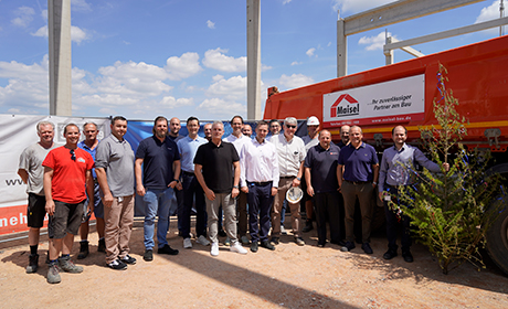Project team at the topping-out ceremony of the new logistics facility